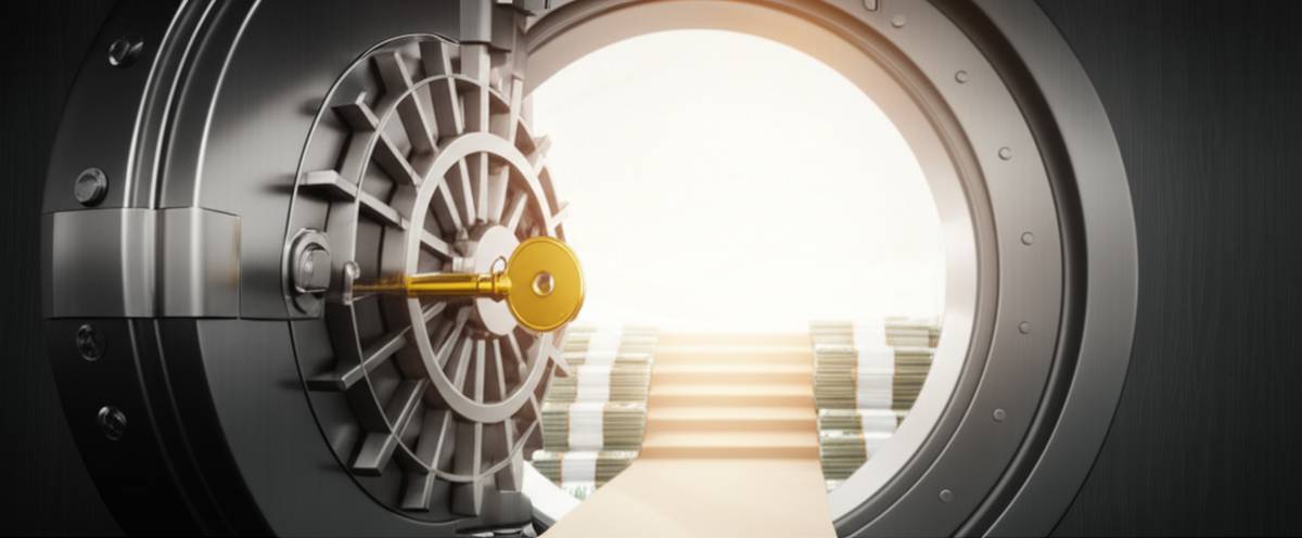Unlock financial freedom: Golden key opens vault to wealth and opportunity.